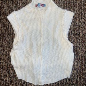 Urban Outfitters cream high-neck, open-back tank top.